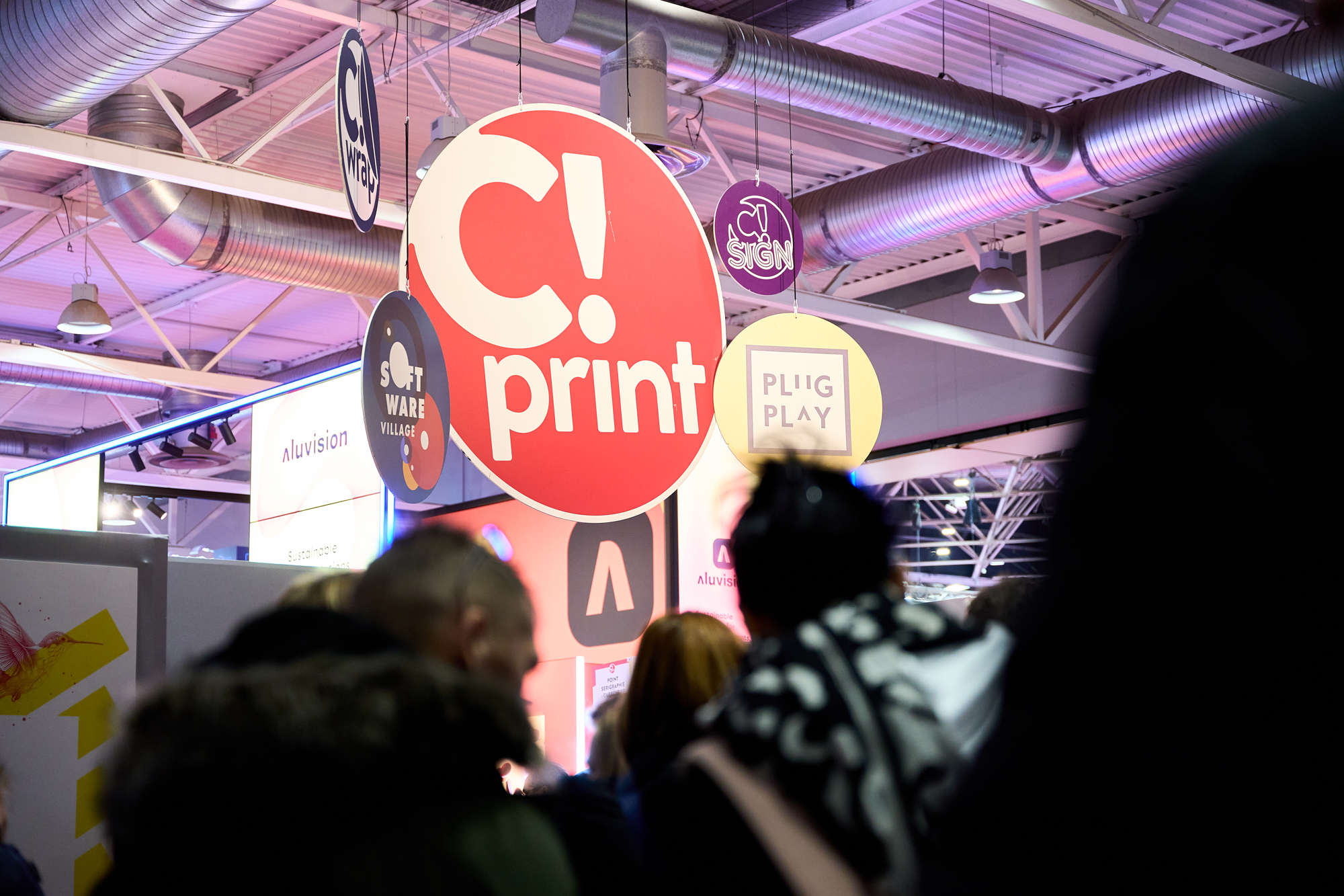 C!Print Lyon - Notre démarche RSE - Logo du C!Print Lyon suspendu