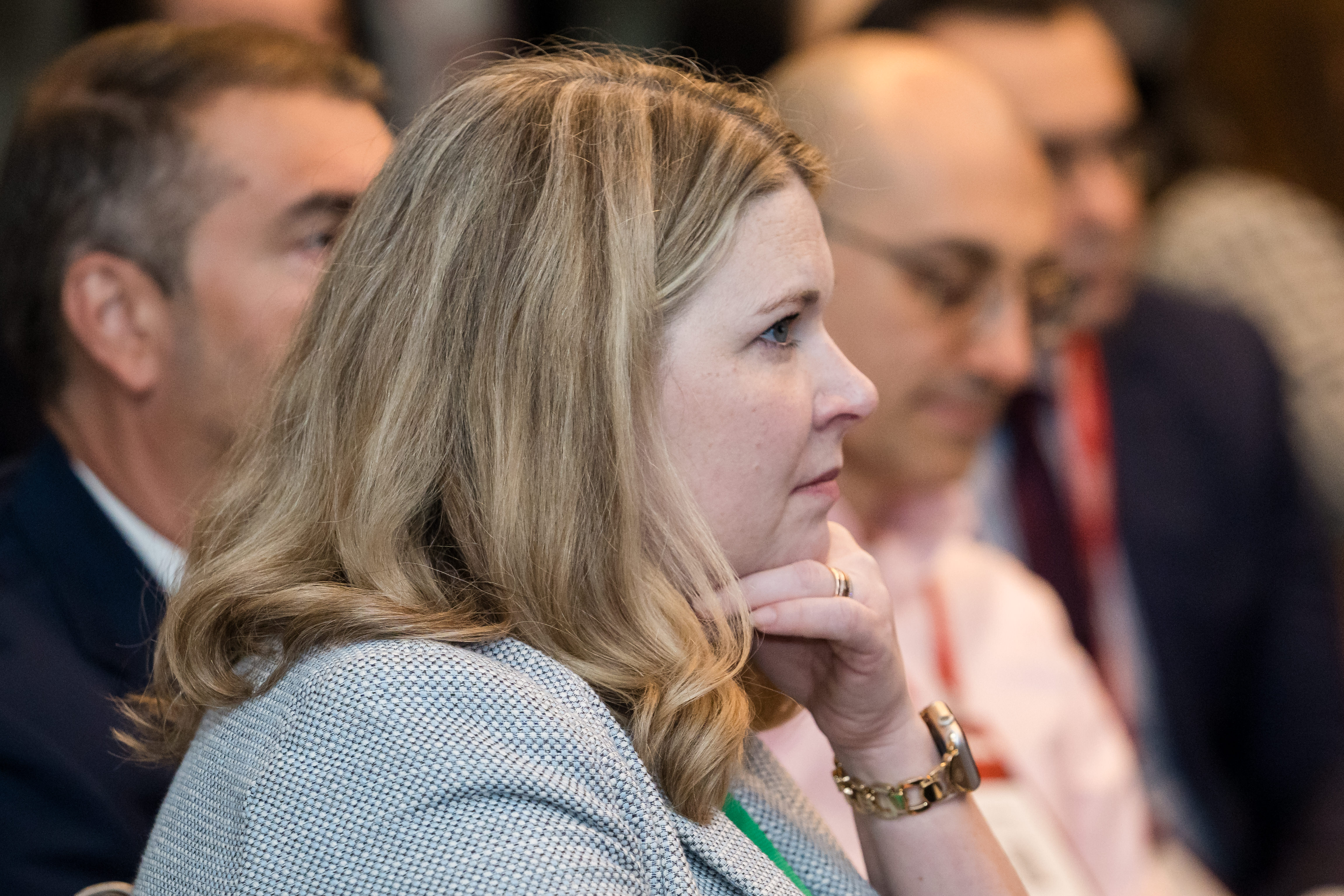 Energy Risk USA audience watching a panel session with four people speaking on stage