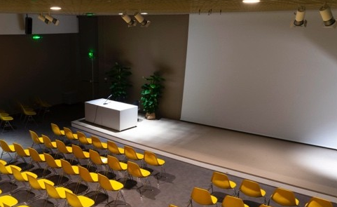 A conference room with yellow seats