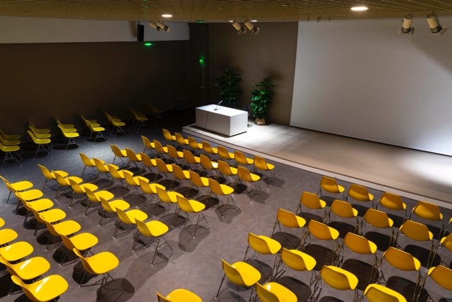 A conference room with yellow seats